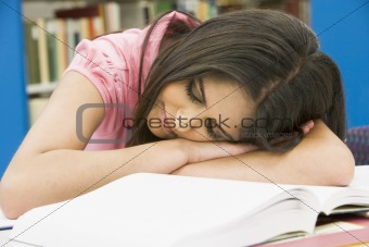Exhausted university student in library