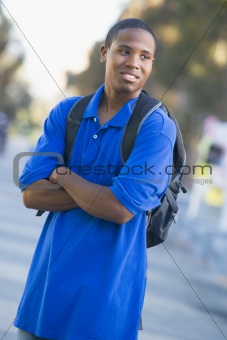 University student with rucksack outside