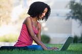 University student using laptop outside