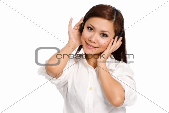 smiling woman listening on her headphone
