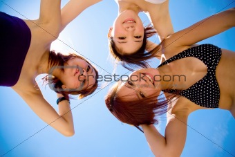 girls friend having fun under sunny blue sky