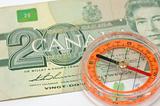 Compass on canada dollar bill