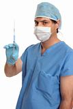 Surgeon with vaccine or drug in syringe