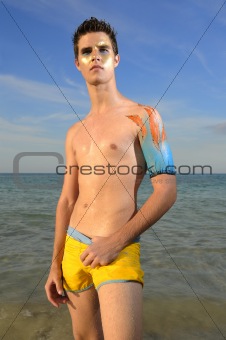 young male model on the beach