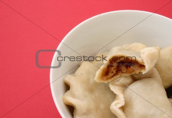 bowl of traditional Polish dumplings with cabbage