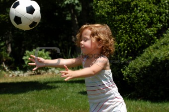Little girl catches soccer ball