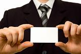 Businessman holding blank business card with both hands