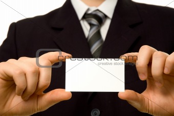 Businessman holding blank business card with both hands