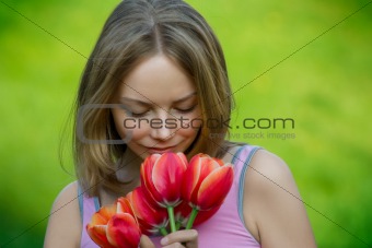 beautiful young lady with flowers outdoor smiling