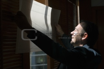 Man Reviewing Plans