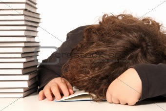 boy sleeping and and many books