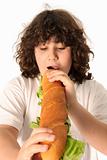 boy eating large sandwich