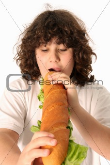 boy eating large sandwich