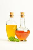 Olive Oil and Vinegar with Basil isolated over white background