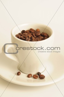 Cup of coffee, full of beans