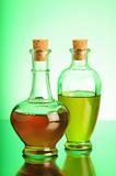 Olive Oil and Vinegar on green backgroundOlive Oil and Vinegar on brown background
