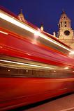 Blurred red London bus