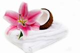 Coconut, lilly flower and white towel