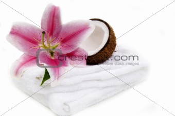 Coconut, lilly flower and white towel