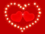 Two 3d red hearts in an environment of shining stars