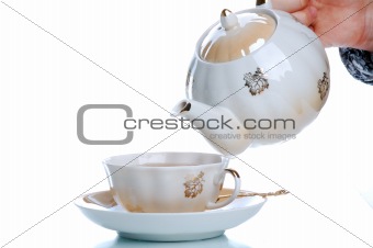 flowing tea into cup