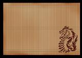 Background - an ancient Japanese mat with the image of a dragon