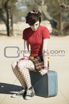 Punk Girl Sitting on Suitcase