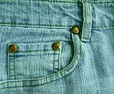 Background a jeans pocket with metal buttons