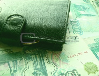 The purse laying on banknotes of Russia