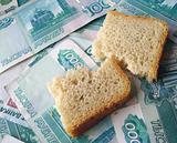 The piece of bread, laying on banknotes of Russia