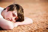 teenager laying on ground