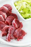 Raw pork meat with iceberg lettuce