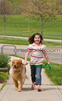 Little Girl Walking Dog
