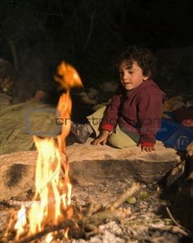 boy at campfire