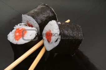 close-up of sushi and chopsticks