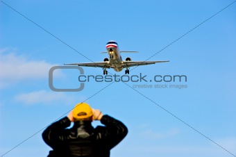 Spectator and Flying Airplane