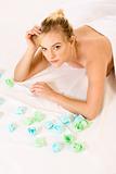 Young blonde female relaxing in spa