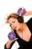 woman listening music in headphones and holding two CD