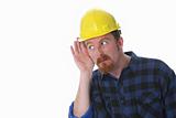 construction worker with hand on ear 