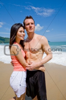 young couple by the beach