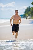caucasian man running on the beach