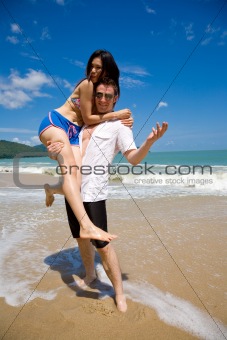 lovers having fun at the beach