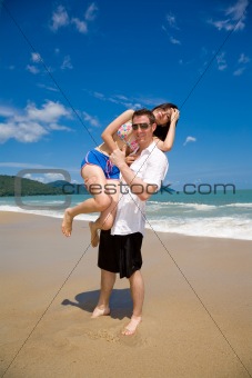 lovers having fun at the beach
