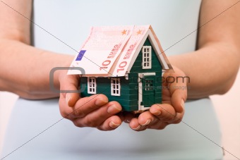 Home insurance concept with euro banknotes