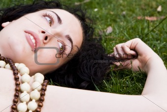 Woman laying on the grass