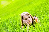 Young pensive on the grass