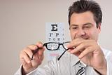 Optometrist examining eye glasses