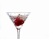 wet strawberry in martini glass
