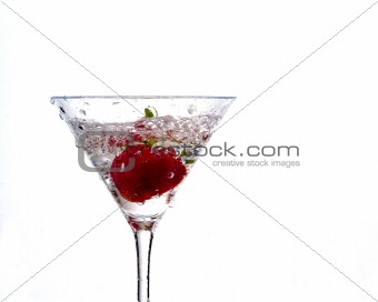 wet strawberry in martini glass