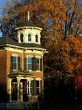 historic house with fall colours on trees